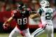 ATLANTA, GA - OCTOBER 07: Tight end Tony Gonzalez #88 of the Atlanta Falcons runs with the ball as strong safety Dawan Landry #26 of the New York Jets defends during their game at the Georgia Dome on October 7, 2013 in Atlanta, Georgia. (Photo by Kevin