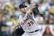 OAKLAND, CA - OCTOBER 10: Justin Verlander #35 of the Detroit Tigers pitches against the Oakland Athletics during Game Five of the American League Division Series at O.co Coliseum on October 10, 2013 in Oakland, California. (Photo by Ezra Shaw/Getty Ima