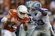 AUSTIN, TX - SEPTEMBER 21: David Ash #14 of the Texas Longhorns is tackled by Blake Slaughter #53 of the Kansas State Wildcats at Darrell K Royal-Texas Memorial Stadium on September 21, 2013 in Austin, Texas. (Photo by Ronald Martinez/Getty Images)
