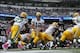 Oct 13, 2013; Baltimore, MD, USA; Green Bay Packers quarterback Aaron Rodgers (12) prepares to hand the ball to running back Eddie Lacy (27) against the Baltimore Ravens at M&T Bank Stadium. Mandatory Credit: Mitch Stringer-USA TODAY Sports