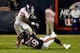 CHICAGO, IL - OCTOBER 10: Running back Brandon Jacobs #34 of the New York Giants is tackled by middle linebacker D.J. Williams #58 of the Chicago Bears during a game at Soldier Field on October 10, 2013 in Chicago, Illinois. (Photo by Jonathan Daniel/Get