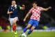 )GLASGOW, SCOTLAND - OCTOBER 15 : Scott Brown of Scotland battles with Nikola Kalinic of Croatia during the FIFA 2014 World Cup Qualifying Group A match between Scotland and Croatia at Hampden Park on October 15, 2013. (Photo by Mark Runnacles/Getty Ima