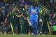 SYDNEY, AUSTRALIA - FEBRUARY 26: Clint McKay of Australia is congratulated by team mates after taking the wicket of Gautam Gambhir of India during the One Day International match between Australia and India at the Sydney Cricket Ground on February 26, 20