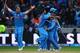 BIRMINGHAM, ENGLAND - JUNE 23: MS Dhoniof India celebrates with his team-mates as India beat England to win the ICC Champions Trophy Final match between England and India at Edgbaston on June 23, 2013 in Birmingham, England. (Photo by Paul Gilham/Getty