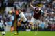 LONDON, ENGLAND - OCTOBER 06: Andros Townsend (L) of Tottenham evades the tackle of West Ham captain Kevin Nolan during the Barclays Premier League match between Tottenham Hotspur and West Ham United at White Hart Lane on October 6, 2013 in London, Engla