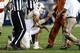 PROVO, UT - SEPTEMBER 7: Quarterback David Ash #14 of the Texas Longhorns is assisted by trainers after he was hurt on a play against the BYU Cougars during the second half of an NCAA football game September 7, 2013 at LaVell Edwards Stadium in Provo, Uta