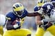 November 10, 2012; Ann Arbor, MI, USA; Michigan Wolverines running back Thomas Rawls (38) stiff arms Northwestern Wildcats linebacker Chi Chi Ariguzo (44) in the second quarter at Michigan Stadium. Mandatory Credit: Rick Osentoski-USA TODAY Sports