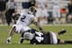 PROVO, UT - OCTOBER 12: Quarterback Vad Lee #2 of the Georgia Tech Yellow Jackets is sacked on a third down play by Remington Peck #44 of the Brigham Young Cougars at LaVell Edwards Stadium October 12, 2013 in Provo, Utah. Georgia Tech lost to BYU 38-20.