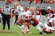 Oct 12, 2013; Raleigh, NC, USA; Syracuse Orange quarterback Terrel Hunt (10) is tackled by North Carolina State Wolfpack linebacker Robert Caldwell (48) at Carter Finley Stadium. Mandatory Credit: Liz Condo-USA TODAY Sports