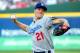 ATLANTA, GA - OCTOBER 04: Zack Greinke #21 of the Los Angeles Dodgers pitches in the first inning against the Atlanta Braves during Game Two of the National League Division Series at Turner Field on October 4, 2013 in Atlanta, Georgia. (Photo by Scott C