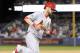 October 15, 2013; Los Angeles, CA, USA; St. Louis Cardinals right fielder Shane Robinson (43) rounds the bases after hitting a solo home run in the seventh inning against the Los Angeles Dodgers in game four of the National League Championship Series bas