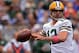 BALTIMORE, MD - OCTOBER 13: Quarterback Aaron Rodgers #12 of the Green Bay Packers passes against the Baltimore Ravens in the first quarter at M&T Bank Stadium on October 13, 2013 in Baltimore, Maryland. (Photo by Patrick Smith/Getty Images)