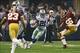 Oct 13, 2013; Arlington, TX, USA; Dallas Cowboys running back Joseph Randle (21) runs the ball by Washington Redskins inside linebacker Perry Riley (56) during the game at AT&T Stadium. The Dallas Cowboys beat the Washington Redskins 31-16. Mandatory Cre