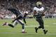 FOXBORO, MA - OCTOBER 13: Running back Khiry Robinson #29 of the New Orleans Saints scores a touchdown in front of cornerback Kyle Arrington #25 of the New England Patriots during the third quarter at Gillette Stadium on October 13, 2013 in Foxboro, Mass