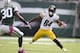 EAST RUTHERFORD, NJ - OCTOBER 13: Wide receiver Antonio Brown #84 of the Pittsburgh Steelers attempts to avoid the tackle of defensive back Darrin Walls #30 of the New York Jets on October 13, 2013 at MetLife Stadium in East Rutherford, New Jersey. (Photo