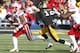 IOWA CITY, IA - NOVEMBER 23: Running back Ameer Abdullah #8 of the Nebraska Cornhusker rushes up field during the second quarter in front of defensive back Collin Sleeper #10 of the Iowa Hawkeyes on November 23, 2012 at Kinnick Stadium in Iowa City, Iowa