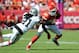 Oct 13, 2013; Kansas City, MO, USA; Kansas City Chiefs running back Jamaal Charles (25) runs the ball as Oakland Raiders cornerback Mike Jenkins (21) attempts the tackle during the second half at Arrowhead Stadium. The Chiefs won 24-7. Mandatory Credit: D