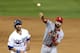 Matt Carpenter throws to first base to complete a double play during Game 4 of the NLCS against the Dodgers.