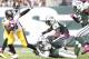 EAST RUTHERFORD, NJ - OCTOBER 13: Running Back Le'Veon Bell #26 of the Pittsburgh Steelers gets tackled by safety Antonio Allen #39 of the New York Jets on October 13, 2013 at MetLife Stadium in East Rutherford, New Jersey. (Photo by Mitchell Leff/Getty I