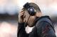 FOXBORO, MA - SEPTEMBER 22: Head coach Greg Schiano holds his head during the fourth quarter of their 23-3 loss to the New England Patriots at Gillette Stadium on September 22, 2013 in Foxboro, Massachusetts. (Photo by Winslow Townson/Getty Images)