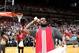 MIAMI, FL - OCTOBER 6: LeBron James #6 of the Miami Heat throws t-shirts to fans before the Red & White scrimmage game on October 6, 2013 at American Airlines Arena in Miami, Florida. NOTE TO USER: User expressly acknowledges and agrees that, by downloadi