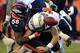 DENVER, CO - NOVEMBER 18: Outside linebacker Von Miller #58 of the Denver Broncos tackles quarterback Philip Rivers #17 of the San Diego Chargers forcing a fumble that was recovered by outside linebacker Wesley Woodyard #52 of the Denver Broncos in the t