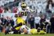 Oct 12, 2013; University Park, PA, USA; Michigan Wolverines quarterback Devin Gardner (98) runs the ball during the second quarter against the Penn State Nittany Lions at Beaver Stadium. Penn State defeated Michigan 43-40 in overtime. Mandatory Credit: Ma