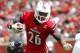 LOUISVILLE, KY - SEPTEMBER 21: Michael Dyer #26 of the Louisville Cardinals breaks free from Justin Halley #32 of the Florida International Panthers during their game at Papa John's Cardinal Stadium on September 21, 2013 in Louisville, Kentucky. (Photo b