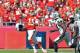 KANSAS CITY, MO - OCTOBER 13: Quarterback Alex Smith #11 of the Kansas City Chiefs throws a pass down field under pressure from linebacker Kevin Burnett #94 of the Oakland Raiders during the first half on October 13, 2013 at Arrowhead Stadium in Kansas Ci