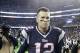 Oct 13, 2013; Foxborough, MA, USA; New England Patriots quarterback Tom Brady (12) runs off the field after defeating the New Orleans Saints at Gillette Stadium. The Patriots defeated the Saints 30-27. Mandatory Credit: Stew Milne-USA TODAY Sports
