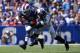 ORCHARD PARK, NY - SEPTEMBER 29: C.J. Spiller #28 of the Buffalo Bills is tackled during NFL game action by Matt Elam #26 of the Baltimore Ravens as he carries the ball at Ralph Wilson Stadium on September 29, 2013 in Orchard Park, New York. (Photo by To