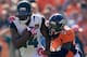 DENVER, CO - OCTOBER 13: Wide receiver Justin Blackmon #14 of the Jacksonville Jaguars makes a pass reception as cornerback Kayvon Webster #36 of the Denver Broncos makes the tackle at Sports Authority Field at Mile High on October 13, 2013 in Denver, Co