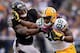 BALTIMORE, MD - OCTOBER 13: Tightend Jermichael Finley #88 of the Green Bay Packers stiff arms linebacker Terrell Suggs #55 of the Baltimore Ravens in the fourth quarter at M&T Bank Stadium on October 13, 2013 in Baltimore, Maryland. (Photo by Patrick Smi