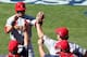 LOS ANGELES, CA - OCTOBER 16: Carlos Beltran #3 of the St. Louis Cardinals celebrates in the dugout with manager Mike Matheny #22 after scoring a run in the third inning against the Los Angeles Dodgers in Game Five of the National League Championship Ser