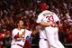 ST LOUIS, MO - OCTOBER 11: David Freese #23 and Daniel Descalso #33 and Matt Holliday #7 of the St. Louis Cardinals celebrate their to 2 win over the Los Angeles Dodgers in Game One of the National League Championship Series at Busch Stadium on October 1