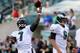 PHILADELPHIA, PA - AUGUST 09: Michael Vick #7 of the Philadelphia Eagles warms up as teamamte Nick Foles #9 stands by before the game against the New England Patriots on August 9, 2013 at Lincoln Financial Field in Philadelphia, Pennslyvania. (Photo by