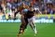HULL, ENGLAND - SEPTEMBER 28: Curtis Davies of Hull City and Kevin Nolan of West Ham battle for the ball during the Barclays Premier League match between Hull City and West Ham United at KC Stadium on September 28, 2013 in Hull, England. (Photo by Matth