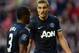 SUNDERLAND, ENGLAND - OCTOBER 05: Nemanja Vidic of Manchester United gestures to Patrice Evra of Manchester United during the Barclays Premier League match between Sunderland and Manchester United at the Stadium of Light on October 5, 2013 in Sunderland,