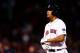 BOSTON, MA - OCTOBER 12: Xander Bogaerts #72 of the Boston Red Sox walks to the dugout after flying out to end Game One of the American League Championship Series against the Detroit Tigers at Fenway Park on October 12, 2013 in Boston, Massachusetts. Th