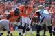 DENVER, CO - OCTOBER 13: Quarterback Peyton Manning #18 of the Denver Broncos directs the offense against the Jacksonville Jaguars at Sports Authority Field at Mile High on October 13, 2013 in Denver, Colorado. The Broncos defeated the Jaguars 35-19. (P