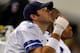ARLINGTON, TX - DECEMBER 24: Tony Romo #9 of the Dallas Cowboys sits on the sidelines with an injured hand against the Philadelphia Eagles at Cowboys Stadium on December 24, 2011 in Arlington, Texas. (Photo by Tom Pennington/Getty Images)