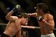 Apr 20, 2013; San Jose, CA, USA; Benson Henderson (right) fights Gilbert Melendez (left) during the lightweight championship bout of the UFC on Fuel TV at HP Pavilion. Mandatory Credit: Kyle Terada-USA TODAY Sports