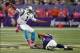 Oct 13, 2013; Minneapolis, MN, USA; Carolina Panthers quarterback Cam Newton (1) breaks the tackle of Minnesota Vikings defensive tackle Kevin Williams (93) in the fourth quarter at Mall of America Field at H.H.H. Metrodome. A holding penalty called the p