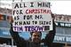 December 23, 2012; Jacksonville, FL, USA; A Jacksonville fan holds up a sign referencing trading New York Jets quarterback Tim Tebow (not pictured) to the Jaguars during the second half of the game against the New England Patriots at EverBank Field. The P