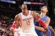HOUSTON, TX - OCTOBER 16: Dwight Howard #12 of the Houston Rockets and Nikola Vucevic #9 of the Orlando Magic battle for the rebound during a 2013 NBA pre-season game on October 16, 2013 at the Toyota Center in Houston, Texas. NOTE TO USER: User expressl
