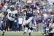 Oct 13, 2013; Foxborough, MA, USA; New Orleans Saints linebacker Junior Galette (93) chases New England Patriots quarterback Tom Brady (12) out of the pocket during the first quarter at Gillette Stadium. Mandatory Credit: Stew Milne-USA TODAY Sports