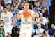 Feb 2, 2013; Chapel Hill, NC, USA; North Carolina Tar Heels guard Marcus Paige (5) passes the ball as forward James Michael McAdoo (43) is in the background in the second half. The Tar Heels defeated the Hokies 72-60 at the Dean E. Smith Center. Mandatory