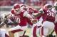 Oct 12, 2013; Fayetteville, AR, USA; Arkansas Razorback quarterback Brandon Allen (10) looks to pitch the ball to fullback Kiero Small (36) as he loses his balance during the first half of a game against the South Carolina Gamecocks at Donald W. Reynolds