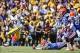Oct 12, 2013; Baton Rouge, LA, USA; LSU Tigers running back Jeremy Hill (33) runs against the Florida Gators during the first quarter of a game at Tiger Stadium. Mandatory Credit: Derick E. Hingle-USA TODAY Sports