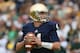 SOUTH BEND, IN - SEPTEMBER 21: Tommy Rees #11 of the Notre Dame Fighting Irish looks for a receiver against the Michigan State Spartans at Notre Dame Stadium on September 21, 2013 in South Bend, Indiana. Notre dame defeated Michigan State 17-13. (Photo